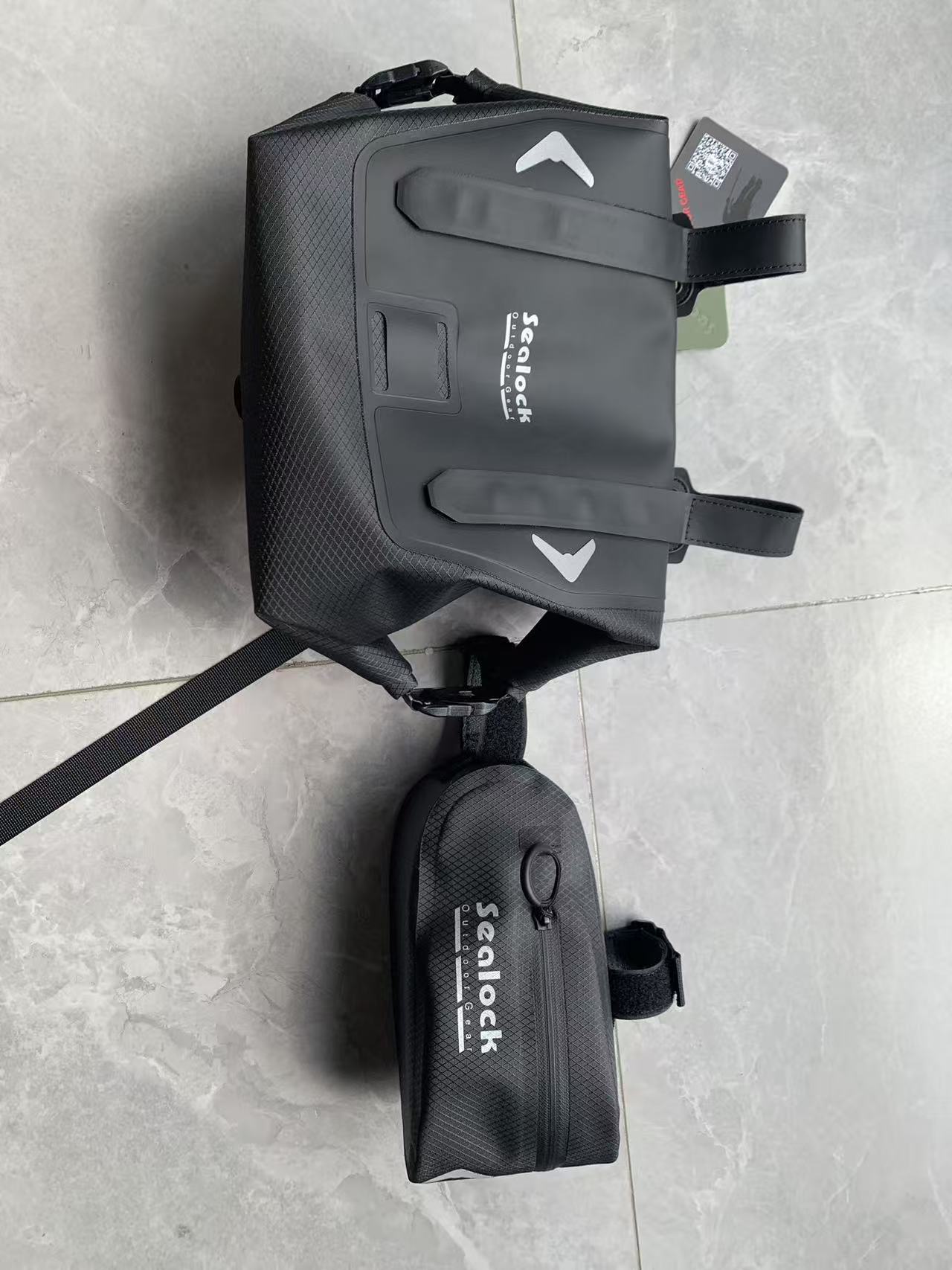 A roll-top rolled 3–4 turns (left) vs a waterproof zipper's rubber gasket (right).